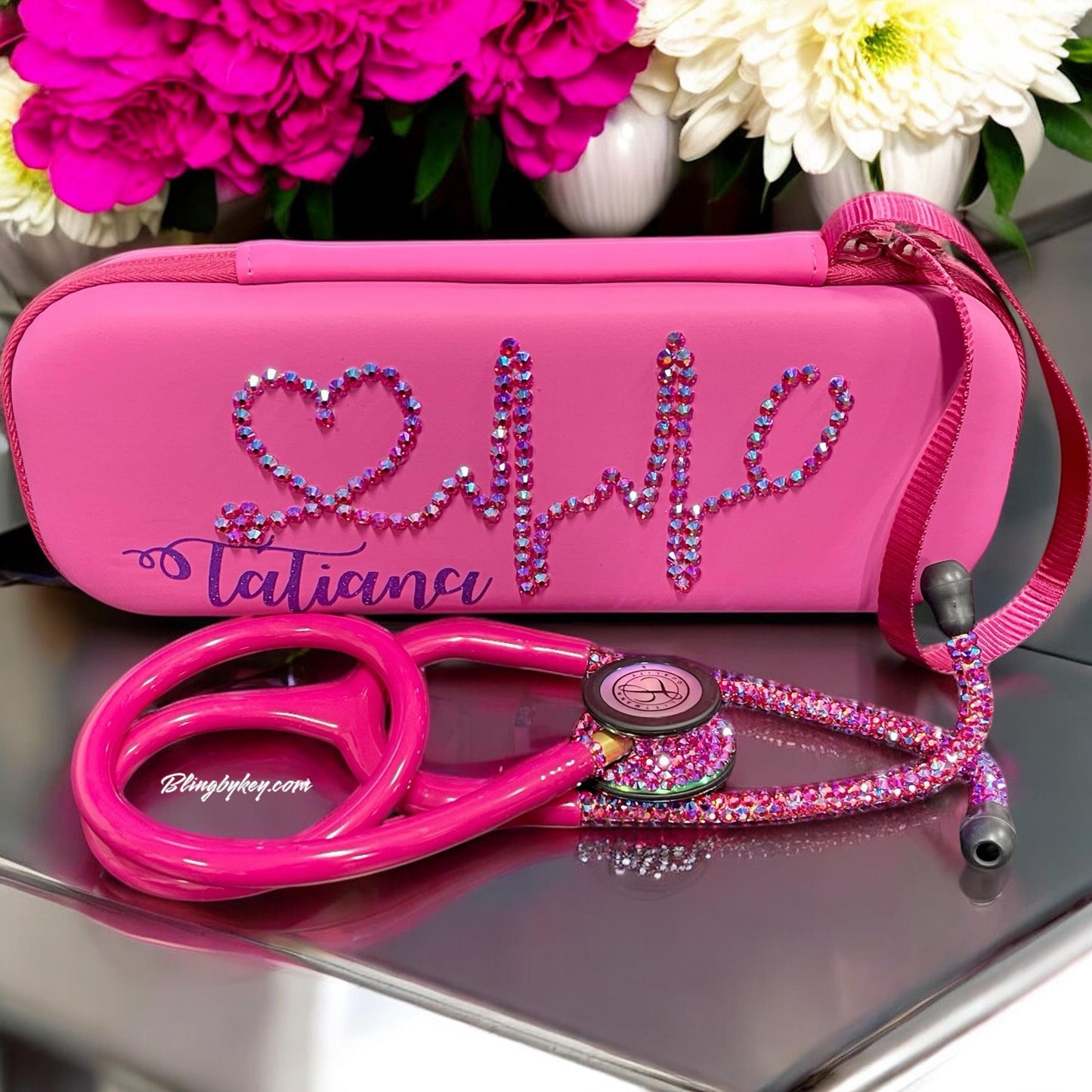 Introducing the Cotton Candy Littmann Classic III Stethoscope, a delightful blend of functionality and style! Featuring a vibrant Rainbow Finish and eye-catching raspberry-colored tubing, this stethoscope stands out with its individually placed iridescent rhinestones on the chest piece and headset. To top it off, it comes with a matching protective hard case and a personalized name displayed in shimmering purple font, making it both a practical tool and a unique expression of your personality!