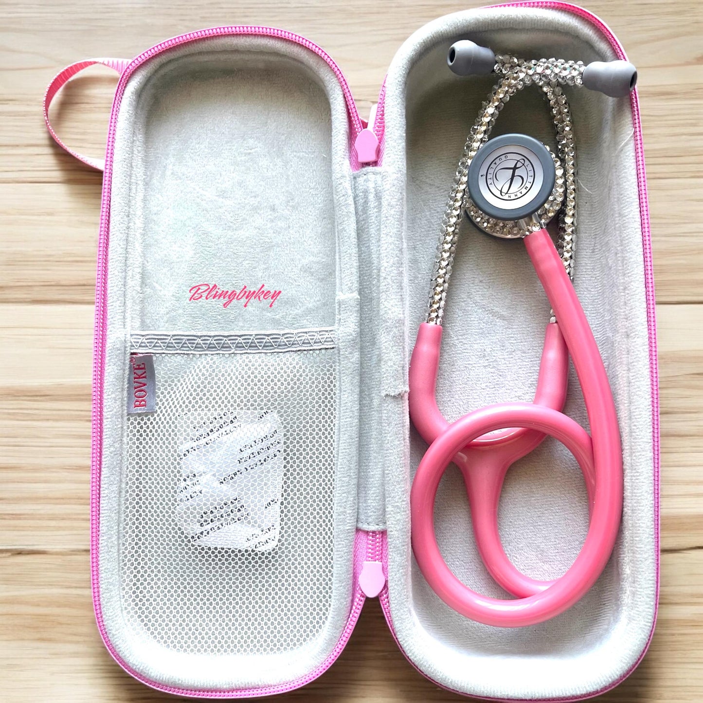 Inner Peace Pink Littmann Classic III Stethoscope, Pearl Pink color tubing, individually placed clear rhinestones on the chest piece and headset, with matching protection hard case and personalized name in shimmering silver font. (sold separately)