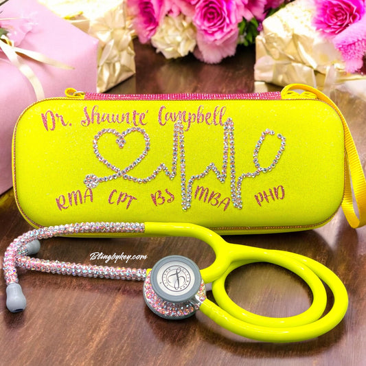 Introducing the "Ray of Sunshine" Littmann Classic III Stethoscope—a fantastic fusion of practicality and flair! With its vibrant yellow tubing, this stethoscope is sure to turn heads. The individually placed pink crystals on the chest piece and headset add a touch of sparkle, making it truly one of a kind. Plus, it comes with a stylish matching hard case and your name beautifully showcased in shimmering pink font. Elevate your medical tools and express your unique personality all at once!